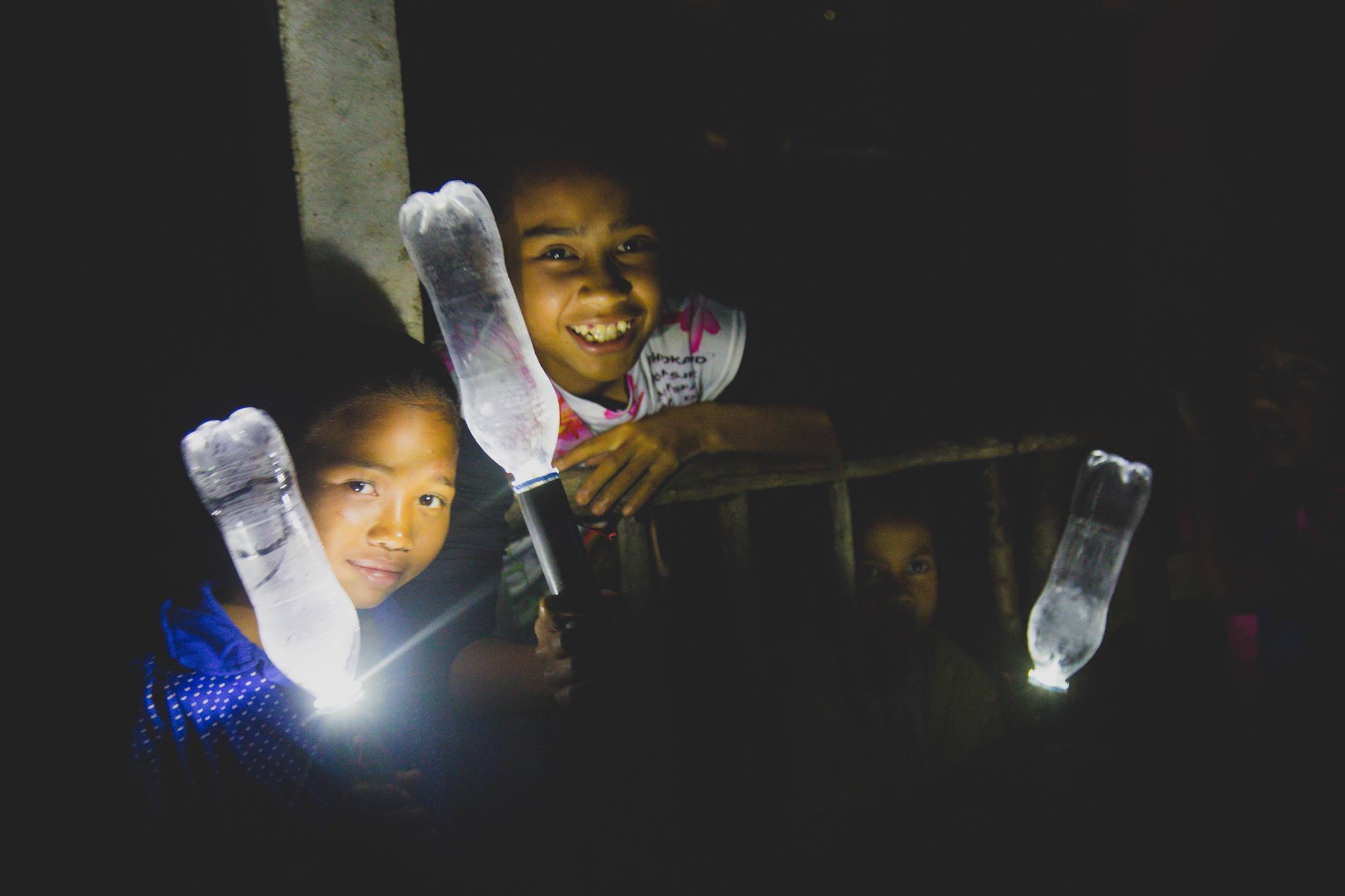 Orang Asli children enjoying the lights at night (Photo by Incitement)