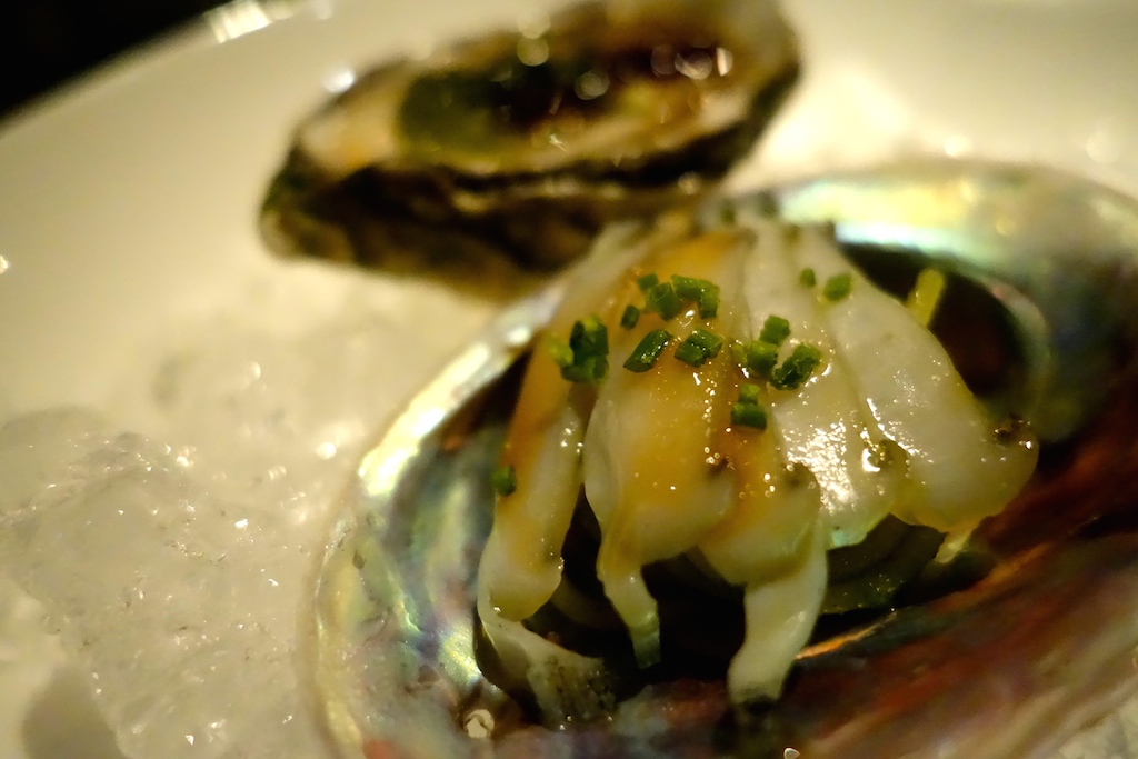 Irish oysters with jellied ponzu, cucumber and seaweed caviar. The grilled abalone in the foreground was served with cold cappelini. 