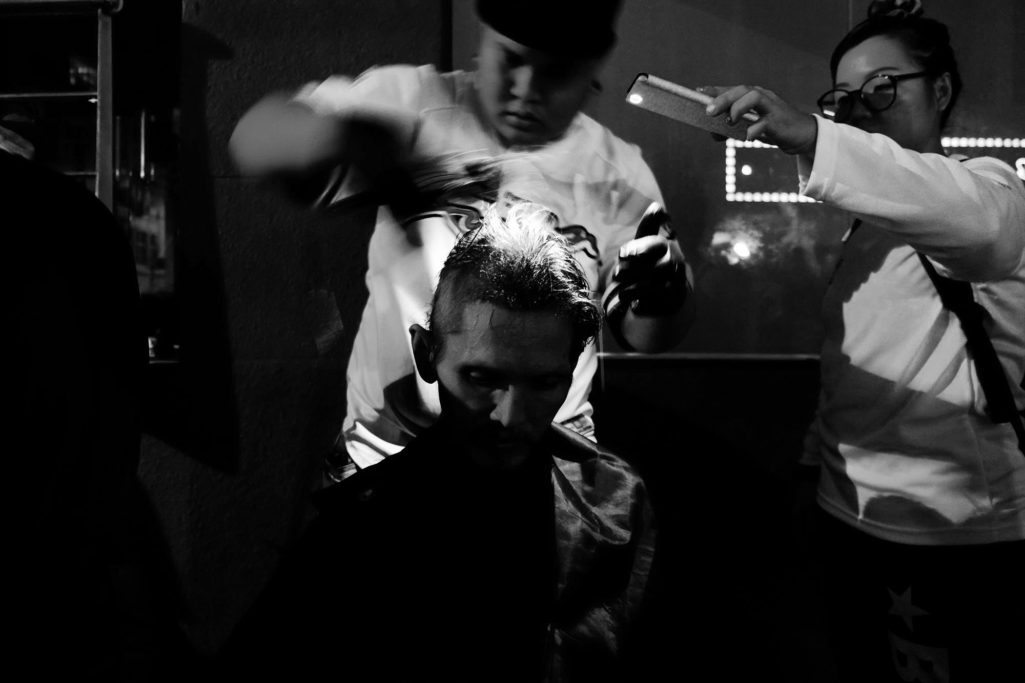 The team led by Lex Low offering free haircuts (Photo by Kamal Sellehuddin/Coconuts KL)