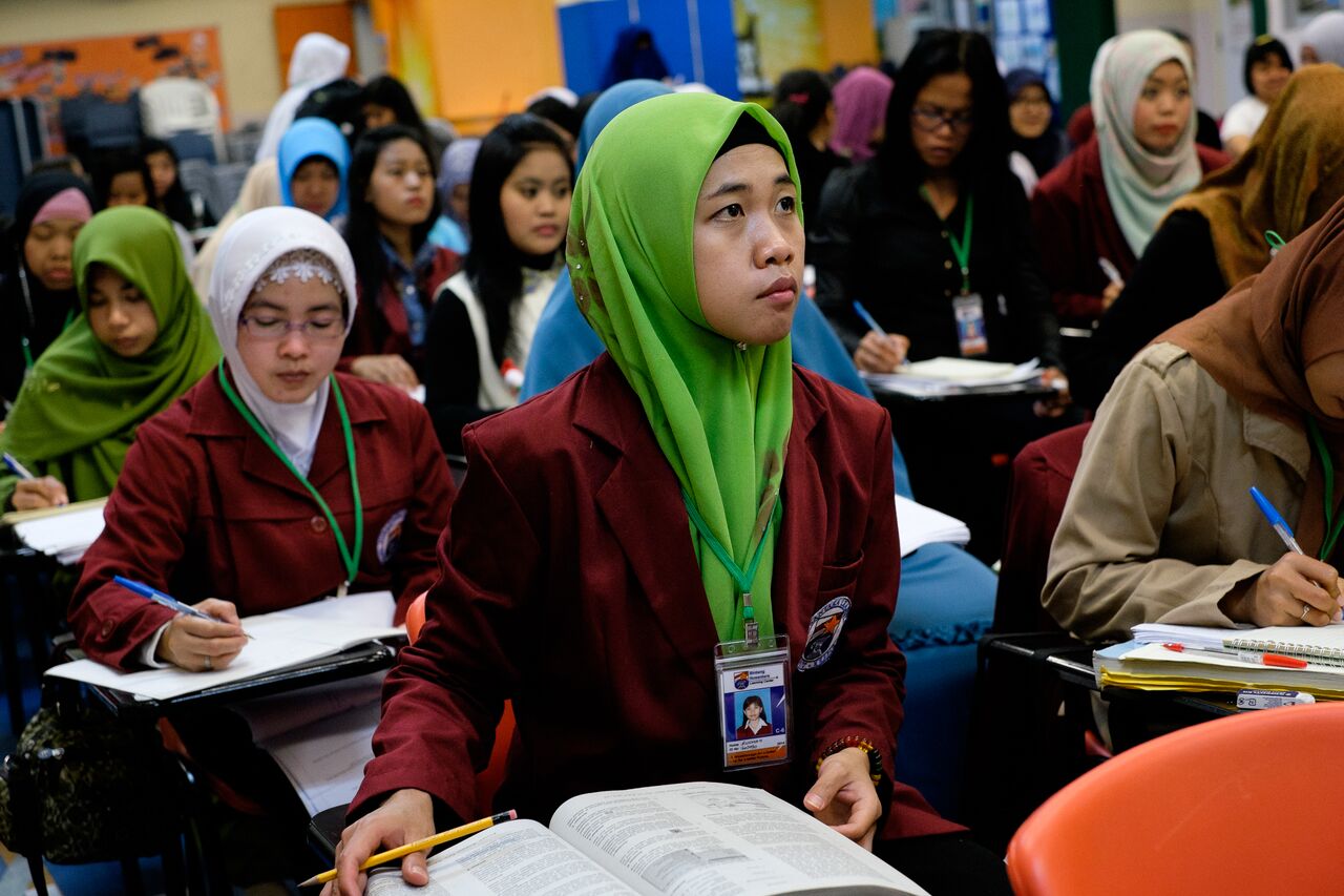 Indonesian domestic workers study at a mathematics class in Sheung Wan on their day off. The class is run by Bintang Nusantara International that provides a variety of classes for migrant domestic workers in Hong Kong. 