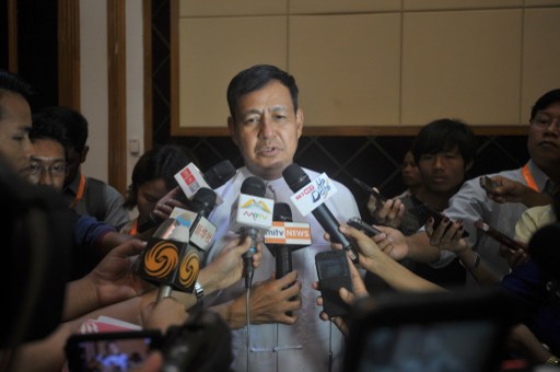 Ye Htut, minister of information, talks to the reporters after Myanmar government officials brief diplomats at the Myanmar Peace Centre (MPC) in Yangon on May 18, 2015, as pressure mounts on the country over a migrant boats crisis gripping Southeast Asia. Photo: AFP / SOE THAN WIN