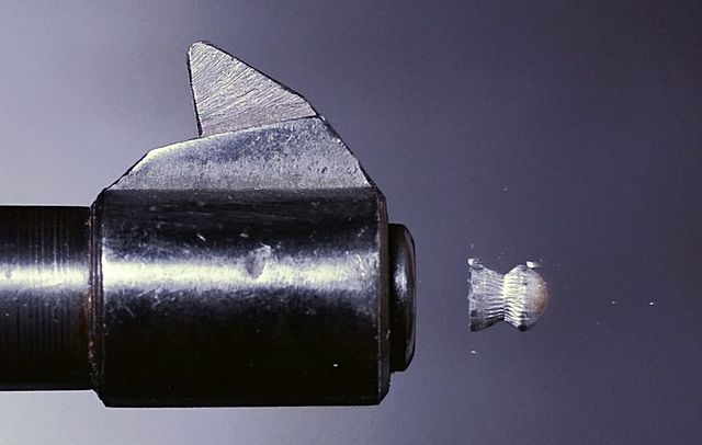 An image of an air pistol firing (via Wikipedia -Niels Noordhoek)