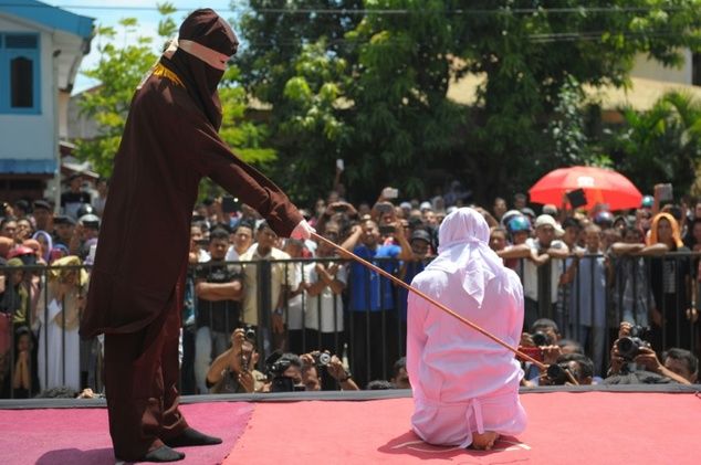 Public caning in Aceh. 2016 AFP FILE PHOTO