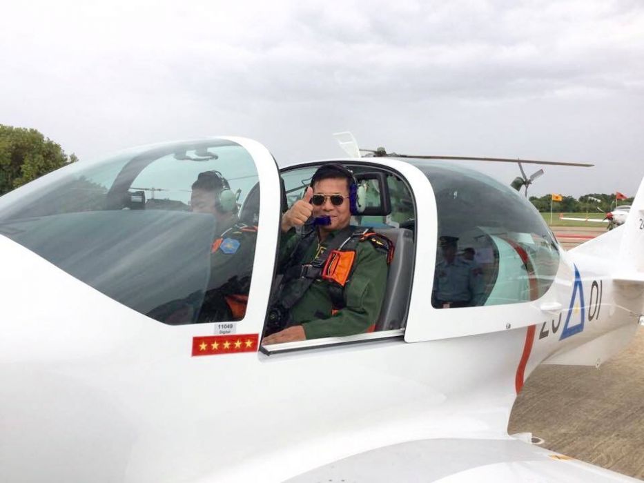 Senior General Min Aung Hlaing poses in a helicopter. Photo: Facebook