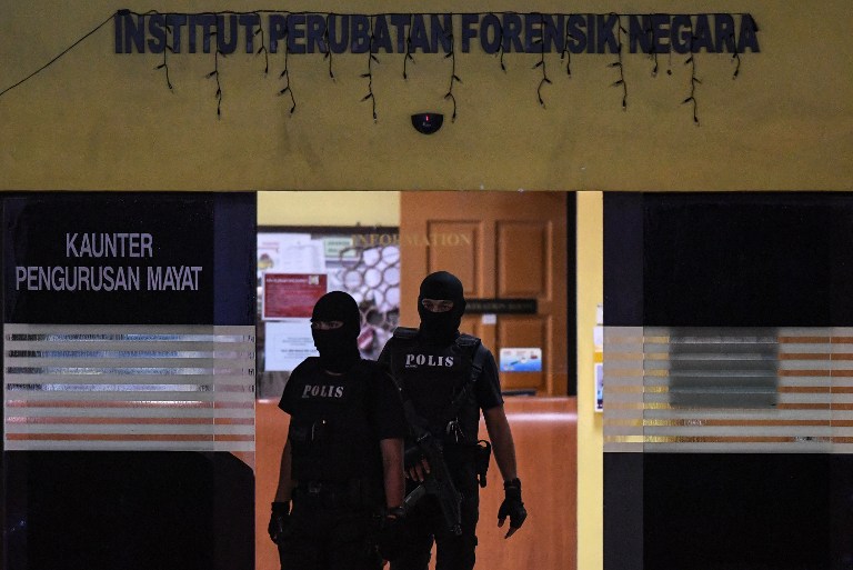 Members of the Royal Malaysian Police special operation forces man the entrance at the forensics wing of the Hospital Kuala Lumpur in the Malaysian capital on February 21, 2017, where the body of a North Korean man suspected to be Kim Jong-Nam, half-brother of North Korean leader Kim Jong-Un, is being kept. Photo: Mohd Rasfan / AFP