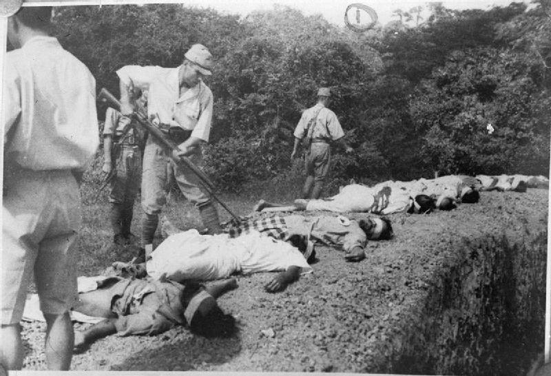 Japanese soldier bayonetting a victim of atrocities carried out by Japanese forces during WW2.