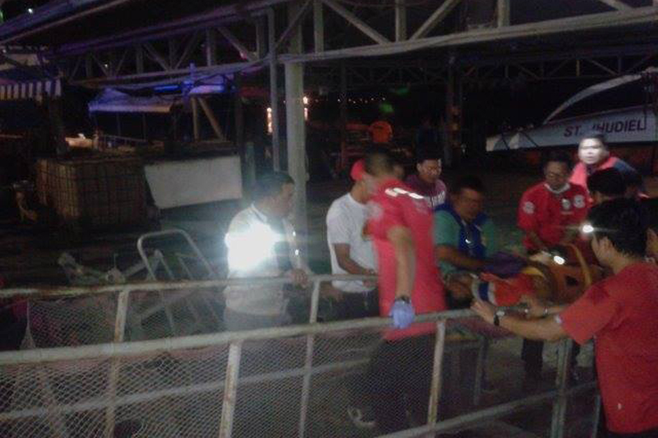 A ferry passenger is carried out to safety. PHOTO: ABS-CBN News