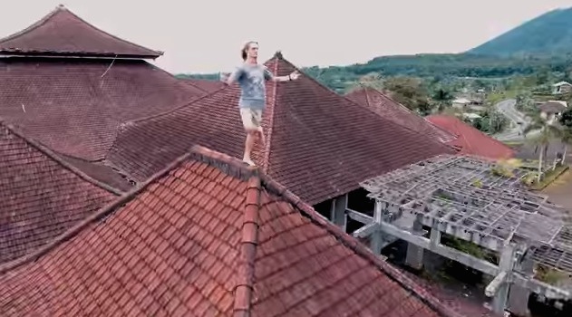 A Russian YouTuber poses on the rooftop of an abandoned hotel in Bali. 