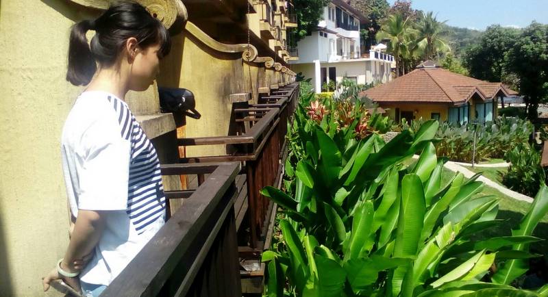 Zhang Min on the balcony of her room. Photo: The Phuket News