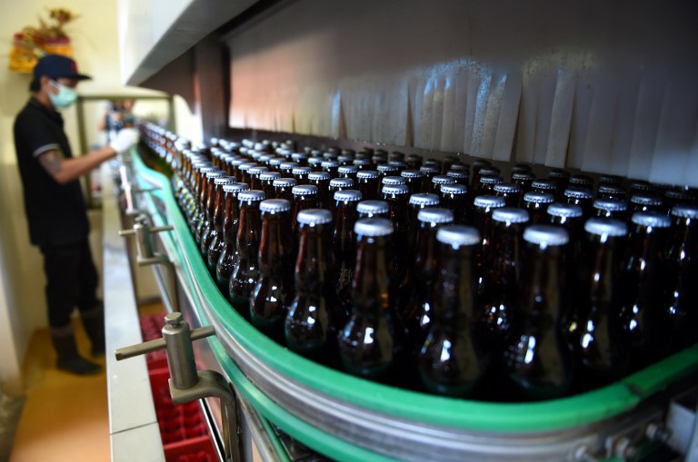 This picture taken on February 24, 2017 shows bottles of beer at the Stark Beer factory in Singaraja, a regency on Indonesia’s Bali island. Defying an escalating anti-alcohol movement and conservative bureaucrats in the world’s most populous Muslim-majority country, Indonesias only craft brewer is tapping into demand for better quality booze among the country’s small number of drinkers. Photo: Sonny Tumbelaka/AFP