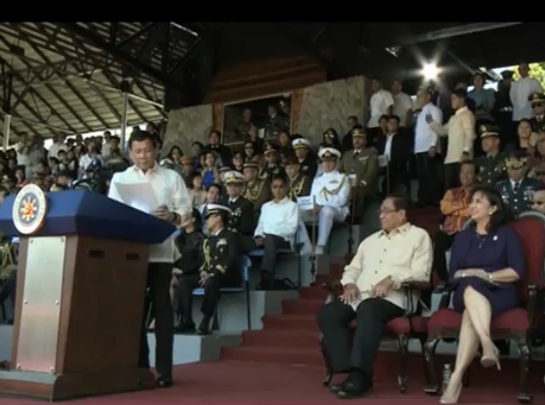 President Rodrigo Duterte shares a light moment with Vice President Leni Robredo at the PMA commencement exercises this Sunday morning. PHOTO: Screengrab from PCO live stream