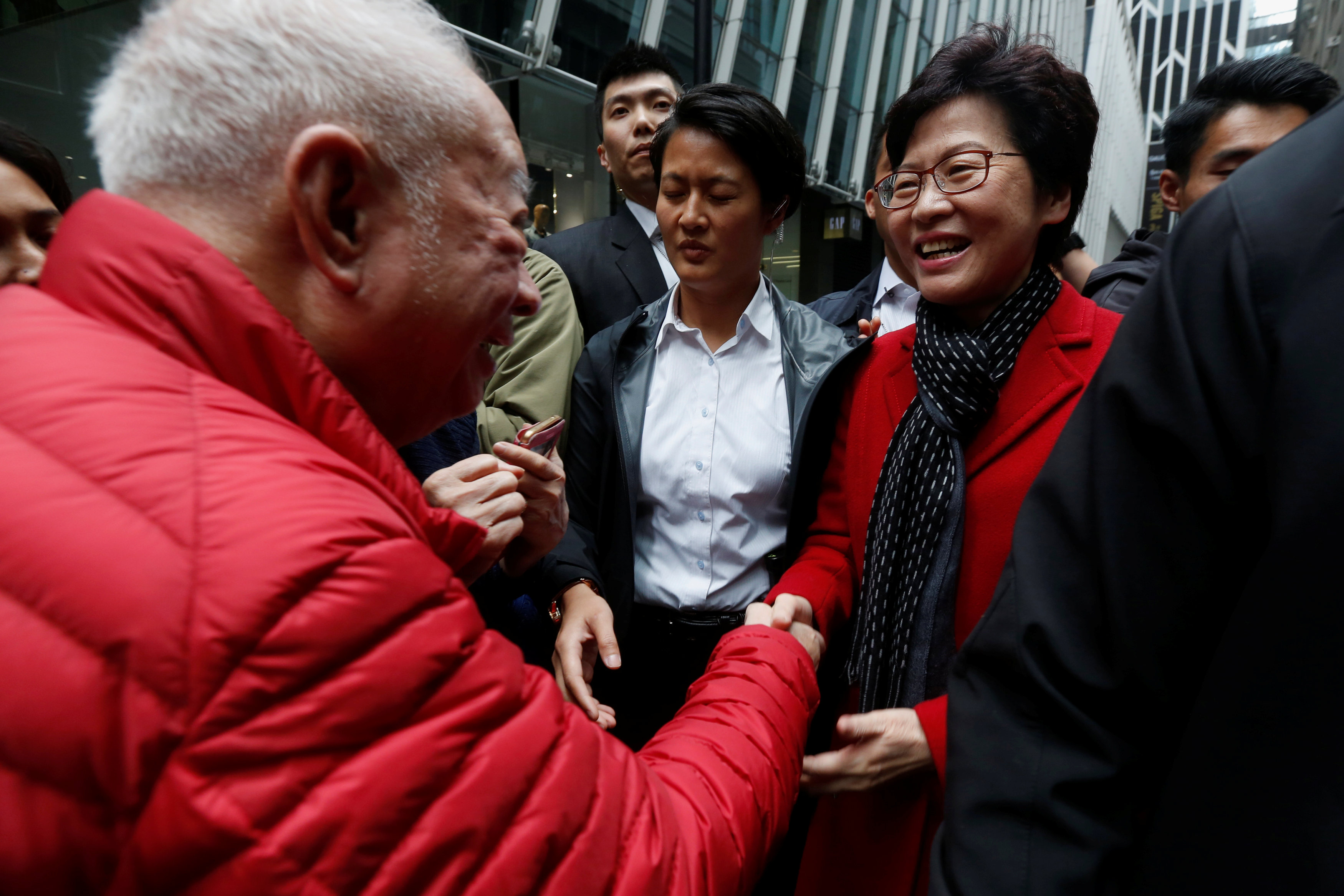 A man shakes hands with Carrie Lam, chief executive-elect, a day after she was elected in Hong Kong. Photo: Bobby Yip/Reuters