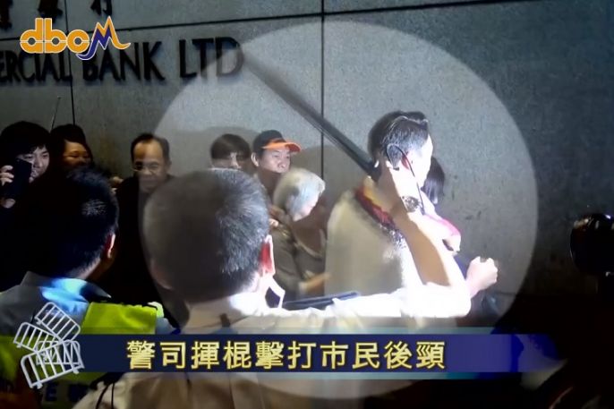 A still of the widely circulated video, in which Chu was seen apparently beating protester Osman Cheng in Nov. 2014. 