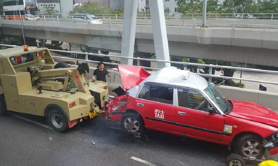 The garbage truck and taxi damaged in the pile-up. Photo: Ken Cheung via Facebook