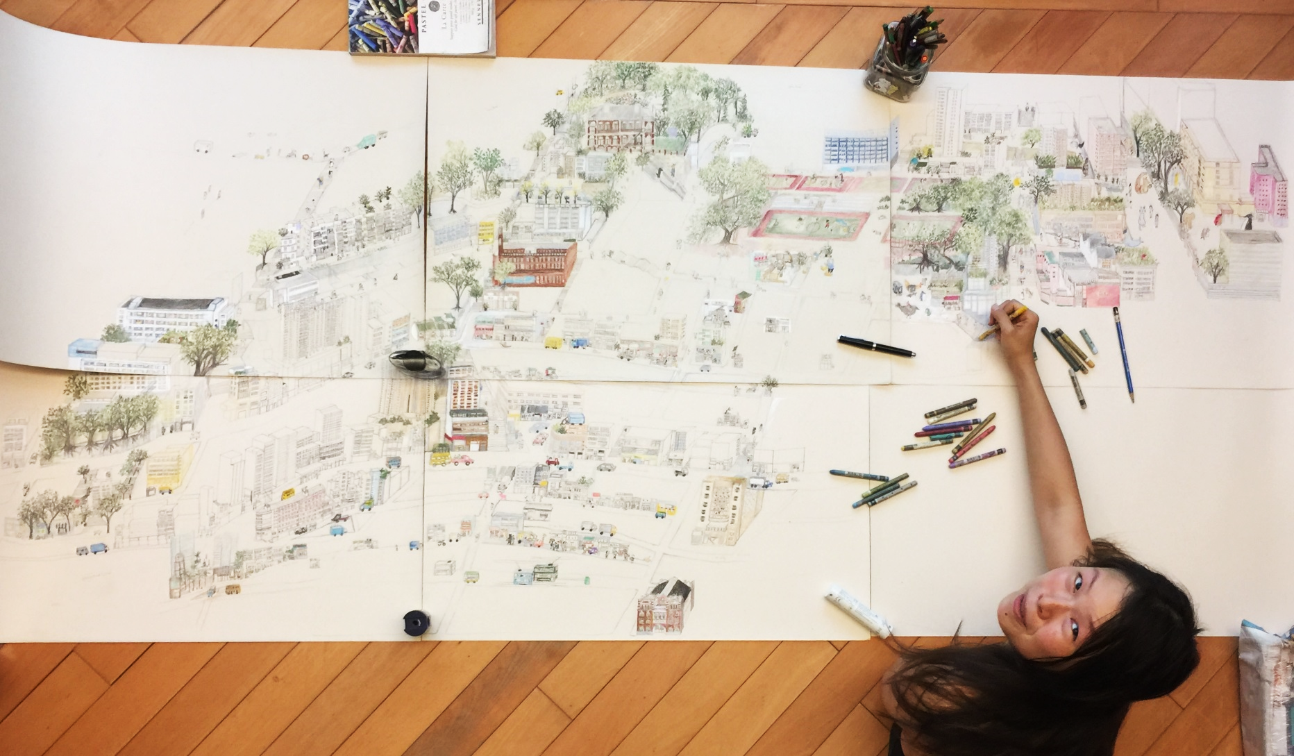 Photo: Connie Yuen drawing her map of Sheung Wan / iDiscover