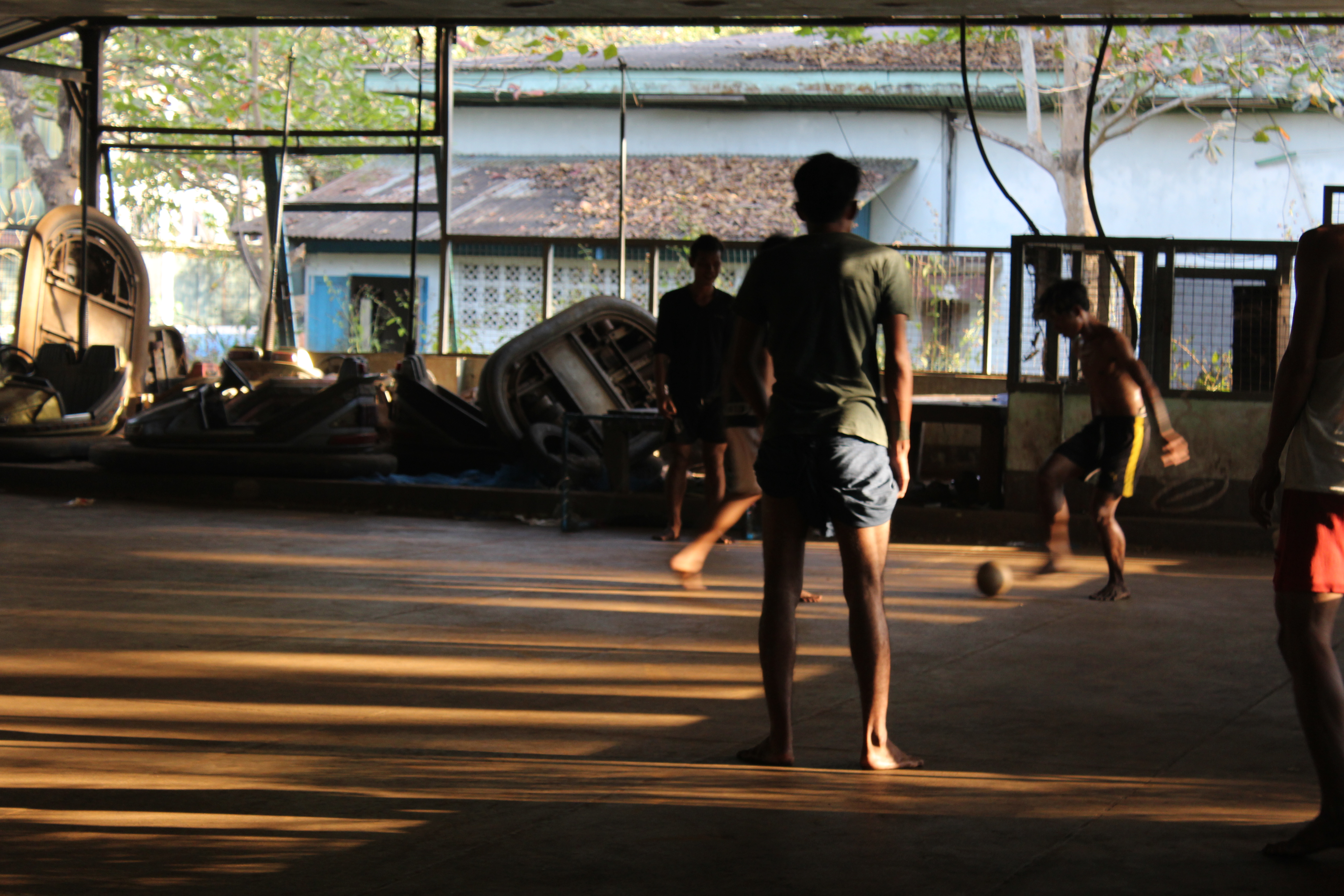 Youths play football in the abandoned amusement park Best Zone. Photo: Jacob Goldberg