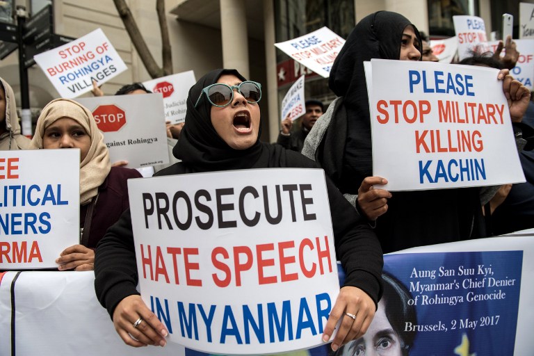 Protesters hold placards and chant during a demonstration against Myanmar’s de facto leader Aung San Suu Kyi, as she attends an event at the Guildhall in the City of London on May 8, 2017.  / AFP PHOTO / CHRIS J RATCLIFFE