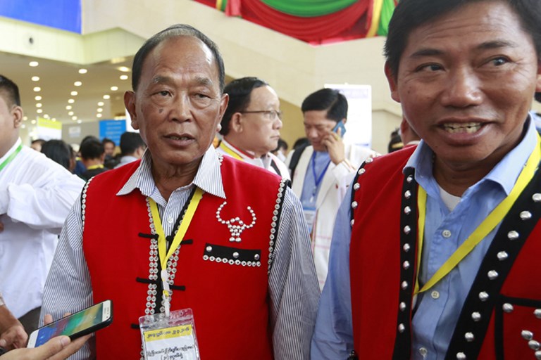 This picture taken on May 24, 2017, shows Wa territory foreign affairs minister Zhao Guo An (L) attending the the second session of the Union Peace Conference in Naypyidaw.
Branded as Asia’s most heavily-armed drug dealers, the China-backed ethnic Wa rebels have emerged as a key player in Myanmar’s peace process, a development seen as strengthening Beijing’s influence over its violence-wracked neighbor. Photo: AFP