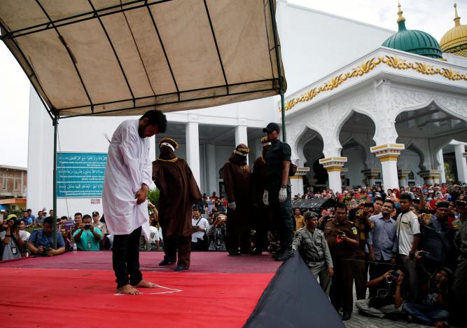 An Indonesian man is publicly caned for having gay sex, in Banda Aceh, Aceh province, Indonesia May 23, 2017. REUTERS/Beawiharta