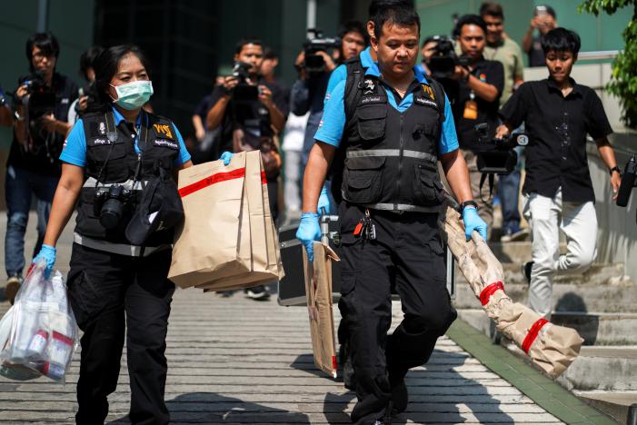Thai forensic experts carry evidence as they leaves from a site of bomb blast at the Phramongkutklao Hospital, in Bangkok, Thailand, May 22, 2017. REUTERS/Athit Perawongmetha