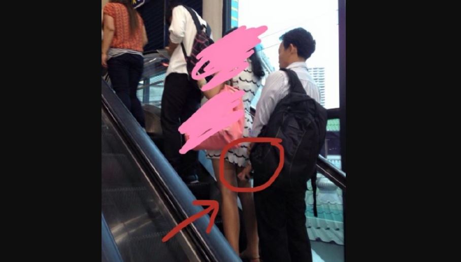 Man caught taking an upskirt on the escalator at Asoke BTS station. Photo: Notey