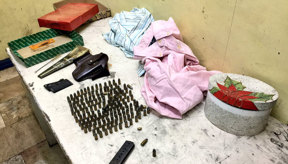 Dozens of .9mm bullets, a pistol magazine and other gun parts were found in a box of relief goods for Marawi. Michael Delizo, ABS-CBN News
