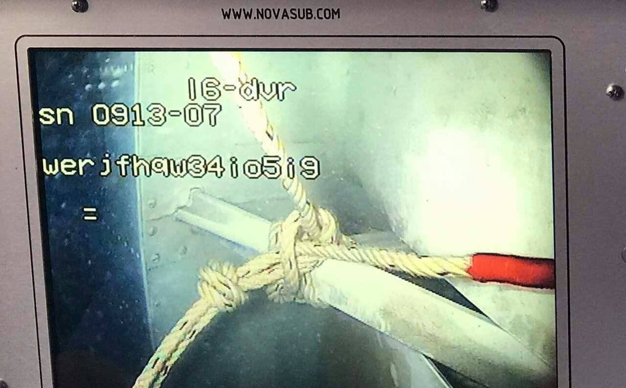 A monitor showing the tail of the missing plane as officials work to retrieve it. Photo: Facebook / Office of the Chief of Defense Services