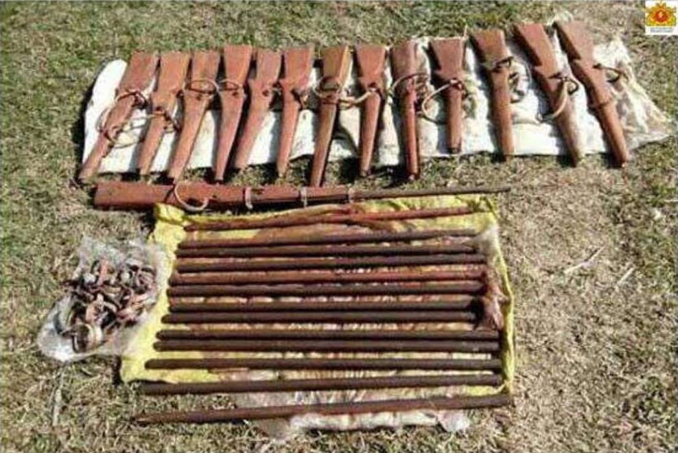 Several guns and wooden sticks that the insurgents reportedly use for practice were also found in the tunnels. Photo: Facebook / State Counsellor Office Information Committee