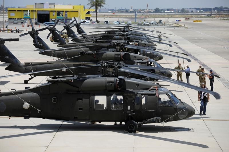 American Black Hawk helicopters are parked in a row during a dress rehearsal of the arrival ceremony which will be held to welcome U.S. President Donald Trump upon his arrival, at Ben Gurion International Airport in Lod, Israel, May 21, 2017. Photo: Amir Cohen/ Reuters