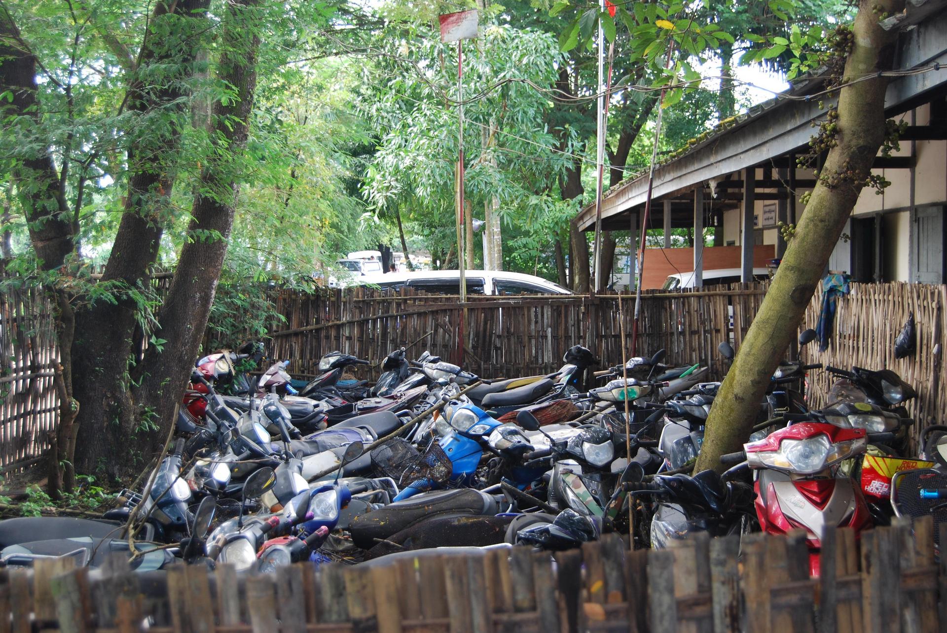 Confiscated motorbikes at the North Okkalapa police station. Photo: Jacob Goldberg
