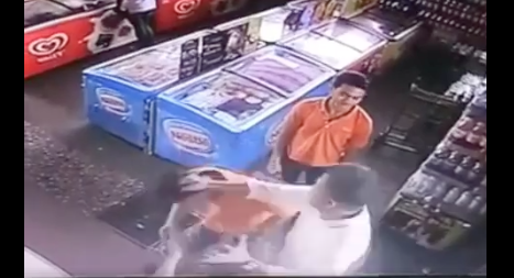 The elderly man in white gets a few good punches in, while the other employee watched