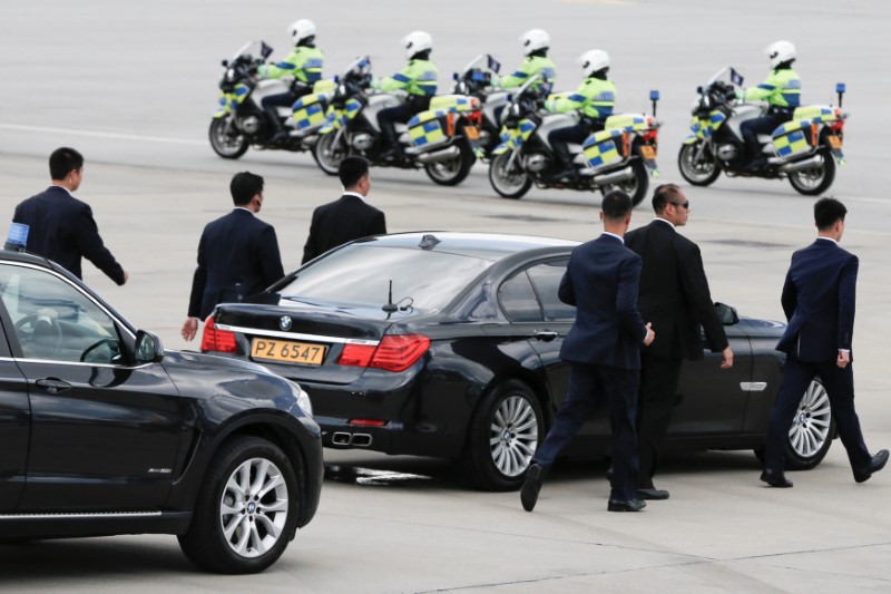 Bodyguards escort the car of Chinese President Xi Jinping after his arrival at Hong Kong airport, ahead of celebrations marking the city’s handover from British to Chinese rule, June 29, 2017.   Photo: Bobby Yip/Reuters