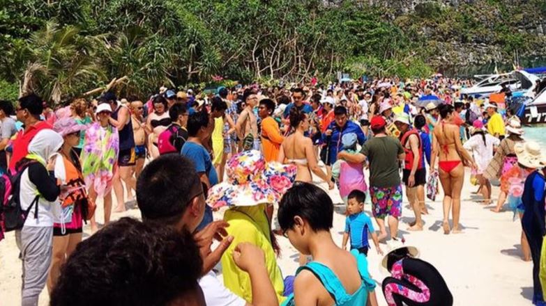 A viral photo of Thailand’s Maya Bay overcrowded with tourists.