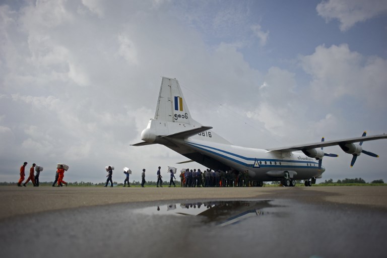 A file photo taken on August 5, 2015, shows a Myanmar Air Force Shaanxi Y-8 transport aircraft being unloaded at Sittwe airport in Rakhine state, similar to the aircraft carrying over 100 people that went missing between the southern city of Myeik and Yangon on June 7, 2017.  AFP PHOTO / Ye Aung Thu