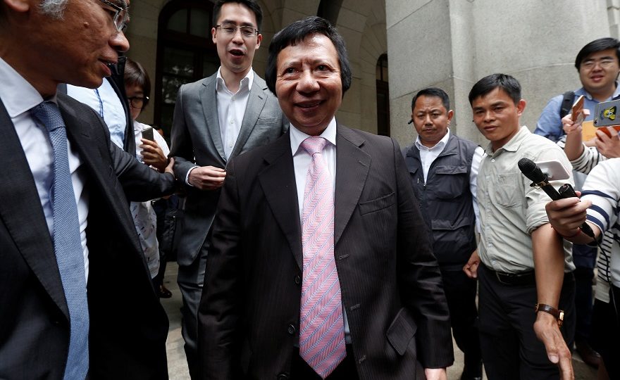 Thomas Kwok (C), former co-chairman of Hong Kong-listed developer Sun Hung Kai Properties, followed by his son Adam, leaves the Court of Final Appeal in Hong Kong, May 10, 2017. File photo: Bobby Yip/Reuters