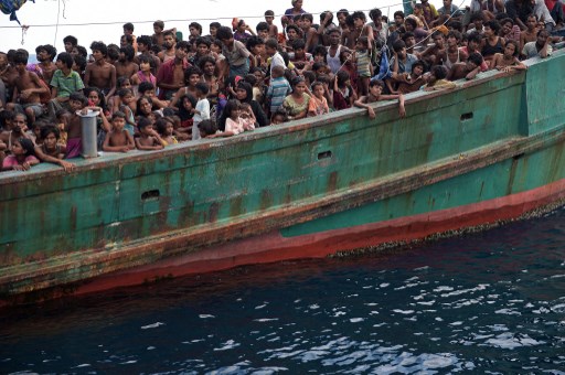 This file photo taken on May 14, 2015 shows Rohingya migrants in a boat drifting in Thai waters off the southern island of Koh Lipe in the Andaman Sea. Photo: AFP . Christophe Archambault