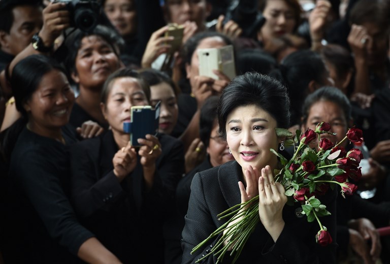 Former Thai prime minister Yingluck Shinawatra speaks to the media as she arrives at the Supreme Court in Bangkok on July 21, 2017. Photo: Lillian Suwanrumpha/ AFP