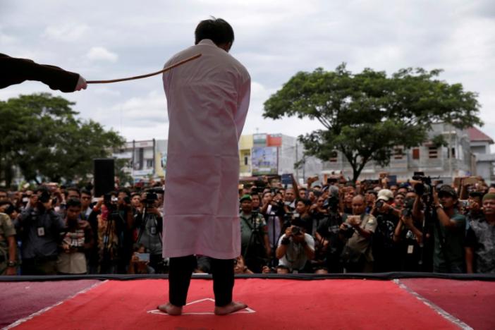 An Indonesian man is publicly caned for having gay sex, in Banda Aceh, Aceh province, Indonesia May 23, 2017. REUTERS/Beawiharta/File Photo