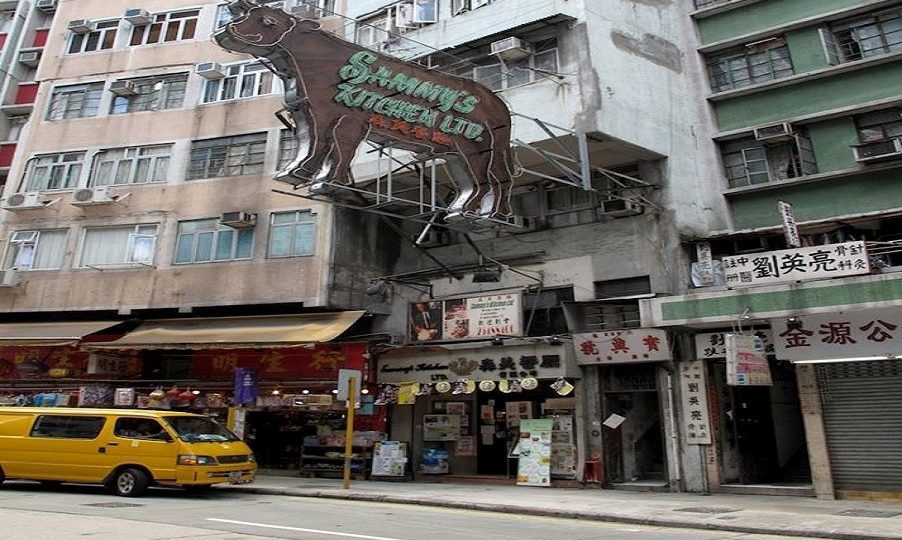 The famous neon cow sign advertising Sammy’s Kitchen hung over the streets of Sai Wan for decades. Photo: Old District via Facebook