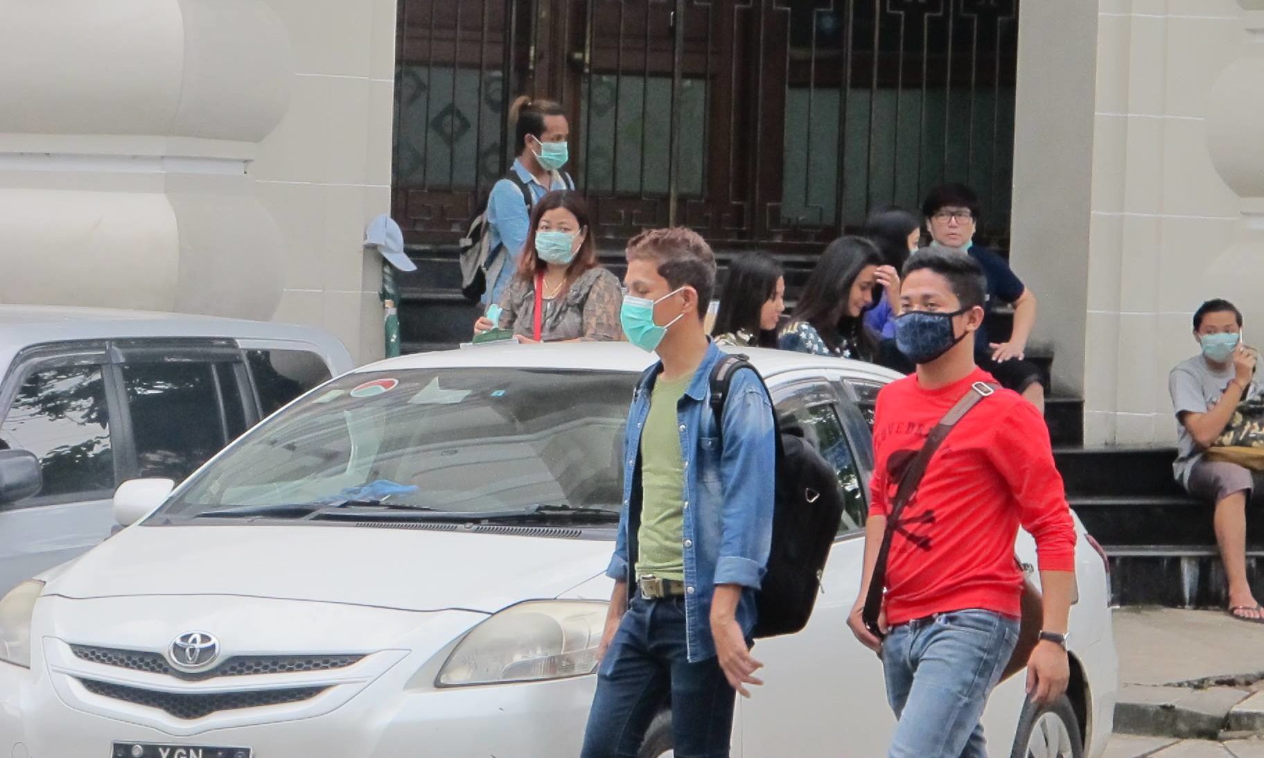 Yangon residents wear face masks after news spreads of a swine flu outbreak. Photo: Facebook / News Watch