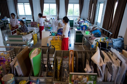 Elderly residents of the “Twilight Villa” nursing home being watched by nurses in one of the centre’s rooms on the edge of Yangon.
PHOTO: AFP / Ye Aung Thu
