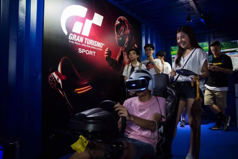 Gaming enthusiasts tried all sorts of games at the first ever Hong Kong eSports festival. PHOTO: AFP