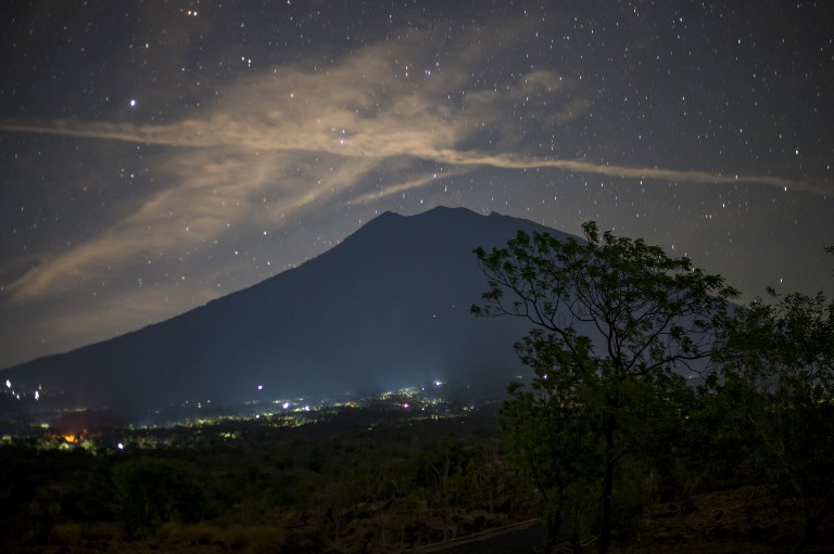 This long exposure photograph shows Mount Agung under a starry sky as seen from Kubu in Karangasem, Bali on Sept. 28, 2017. Photo: Bay Ismoyo/AFP