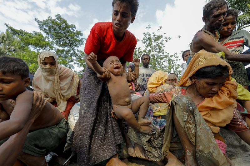 This photo taken on September 5, 2017 shows Rohingya Muslim refugees from Myanmar arriving at a new camp in Unchiprang near the Bangladeshi border town of Teknaf. Within days the 15,000 new arrivals had stripped bare the countryside at Unchiprang, near the border town of Teknaf, transforming the once lush and sparsely inhabited hillsides into a sprawling tent city. Photo: K M ASAD / AFP