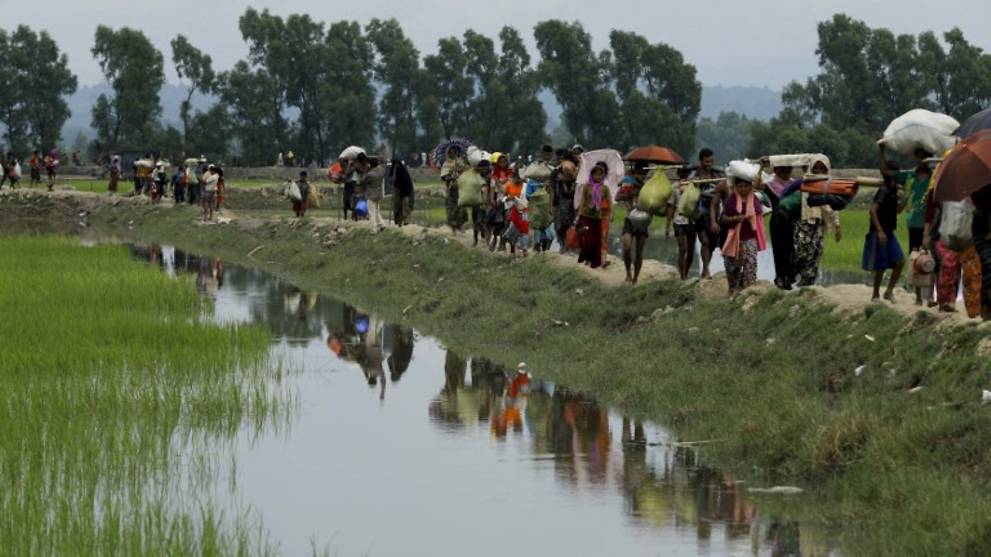 Rohingya refugees arrive from Myanmar through Lomba Beel after crossing the Naf river in the Bangladeshi town of Teknaf on Sep 7, 2017. Photo: AFP / K M Asad