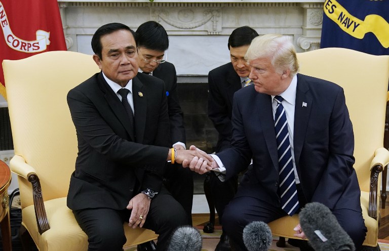 US President Donald Trump and Thailand’s Prime Minister Prayuth Chan-ocha shake hands during a meeting in the Oval Office of the White House on Oct. 2, 2017 in Washington, DC. Photo: Mandel Ngan/ AFP