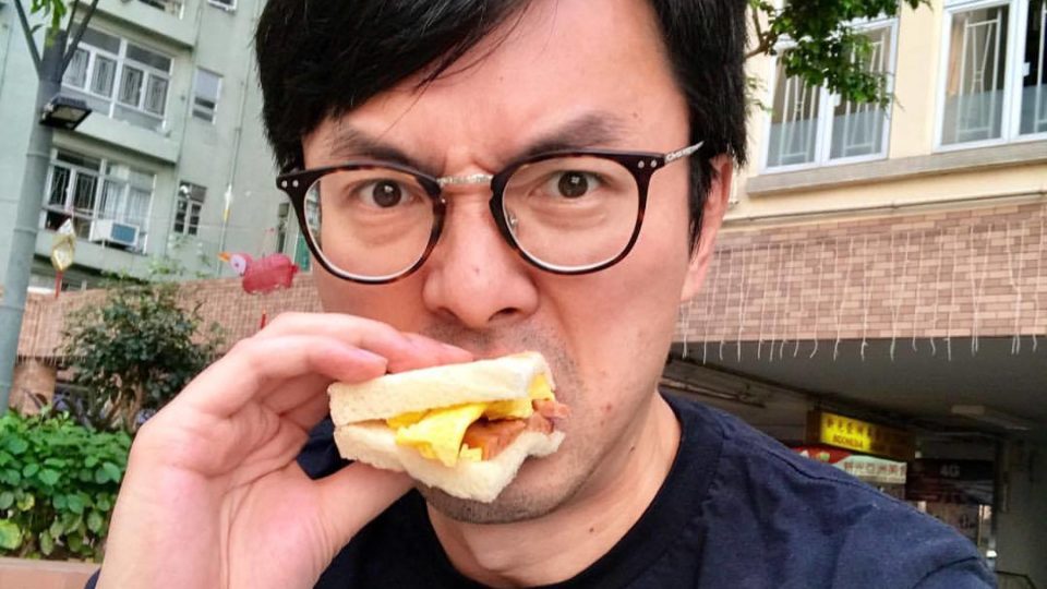 The defendant Avery Ng Man-yuen eating a sandwich in a picture taken from his Facebook account