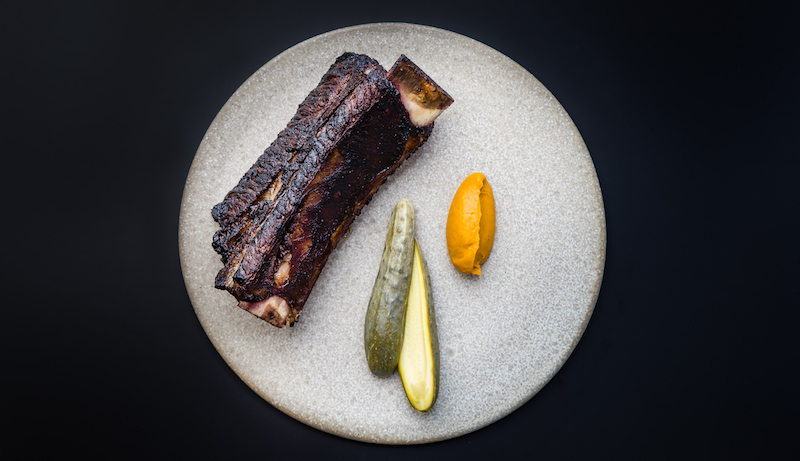 Grilled beef short rib, carrot and kelp puree, and dill pickled cucumber. Photo: Blackwattle 