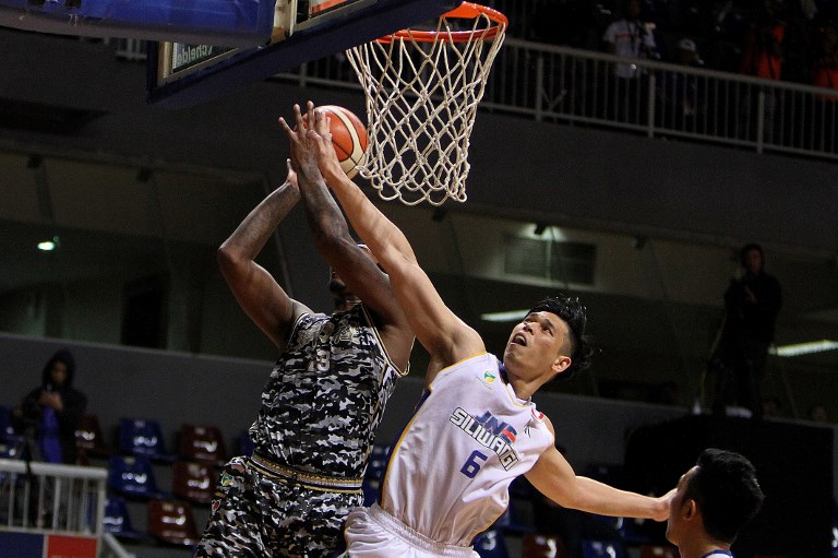This picture taken in Jakarta on March 3, 2017 shows Indonesian Ferdinand Damanik (#6) playing against CLS Knight Surabaya during the Indonesian Basketball League 2017 at the Britama Arena in Jakarta. 
Eight Indonesian pro-basketball players and a team official have been banned for life over match fixing, the league said on November 23, reportedly to help their cash-strapped squad pay salaries. The members of Siliwangi Bandung, one of a dozen teams in the Indonesian Basketball league, were given the boot this week for throwing at least four games last season.
 / AFP PHOTO / STR