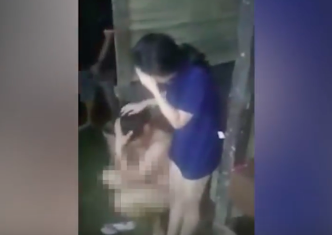 A couple in Tangerang, Indonesia being publicly shamed by villagers after they were caught performing an “immoral act” on November 11, 2017. Photo: Video screencap from Tribunnews.com